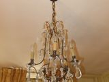 a chandelier hanging from the ceiling in a room