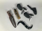 many different types of knives and pliers on the table