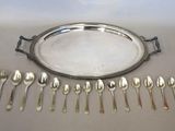 an image of a silver tray with spoons and spoons on it