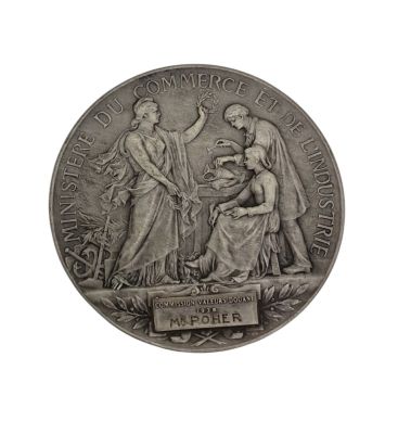 an image of a silver medal with a woman and a man
