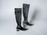 pair of black sued boots on a white background
