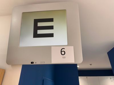 a sign that says e on the wall above the door