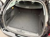 a trunk of a car with the back door open