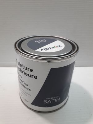 an image of a can of paint sitting on a table