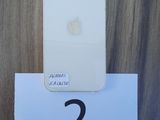 a white iphone sitting on top of a wooden table next to a paper