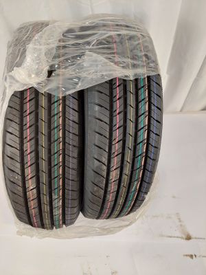 a couple of tires sitting on top of each other on a white surface