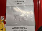 a picture of a manual for a generator on the shelf