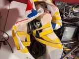 a bag full of assorted items sitting on the floor