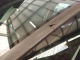 a close up of a car window with a broken glass