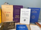 several books are sitting on a table next to each other