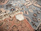 a carpet with a sign on it on the floor
