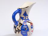 a blue and white vase with a star design on it