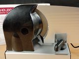a knife sharper sitting on top of a table next to a box
