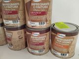 several tins of food are sitting on a shelf in a kitchen