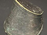 a black hat that is on a black surface