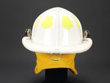 a white fireman ' s helmet on a black stand