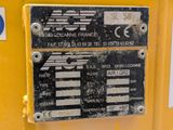 a close up of a sign on the side of a yellow machine