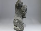 statue of a woman holding a child in her arms