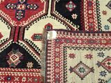 a close up of a rug on a table with a blue background
