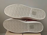 a close up of a pair of shoes on top of a box