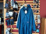 a coat hanging on a wall in a store