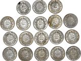 a group of silver coins with the names of different countries