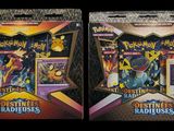 two packs of pokemon trading cards are shown in a box