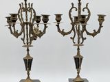 pair of antique brass candelabs on marble bases