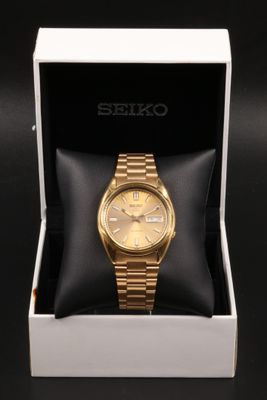 SEIKO - Montre bracelet en acier et métal doré, référence 7S…
