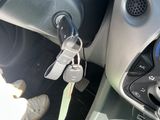 a car dashboard with a bunch of keys attached to it