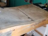 a wooden table that has a piece of paper on top of it