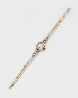 a gold and diamond wrist watch