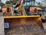 a bulldozer that is sitting in the dirt