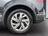 a close up view of a car ' s wheel and tire