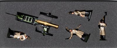 a box with a toy gun and other items in it