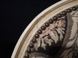 an image of a close up of a chair with beads on it