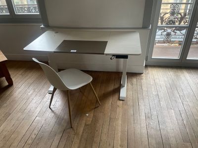 a white desk with a chair in front of a window