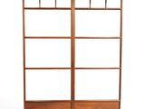 an image of a wooden bookcase with glass shelves