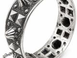 a close up of a silver bracelet with a chain on it