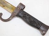 a close up of a knife on a white surface