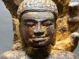 a close up of a statue of a person with a hat on