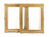 a pair of antique gold picture frames on a white background