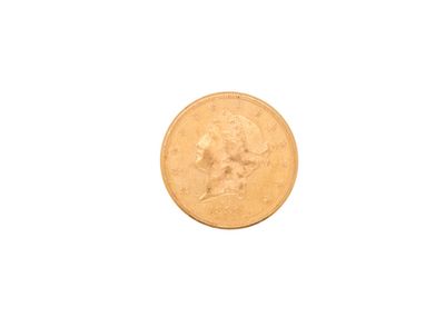 a close up of a gold coin on a white background