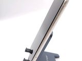 a cell phone that is sitting on top of a stand