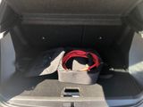 a bag in the trunk of a car with a seat belt in it