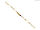 gros plan d'un bracelet en or sur fond blanc