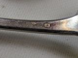 a pair of scissors sitting on a table next to a bowl of fruit