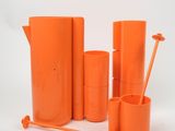a group of orange vases and cups on a white background