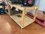 a workbench with a laptop on top of it