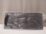 a black and white photo of a purse on a table